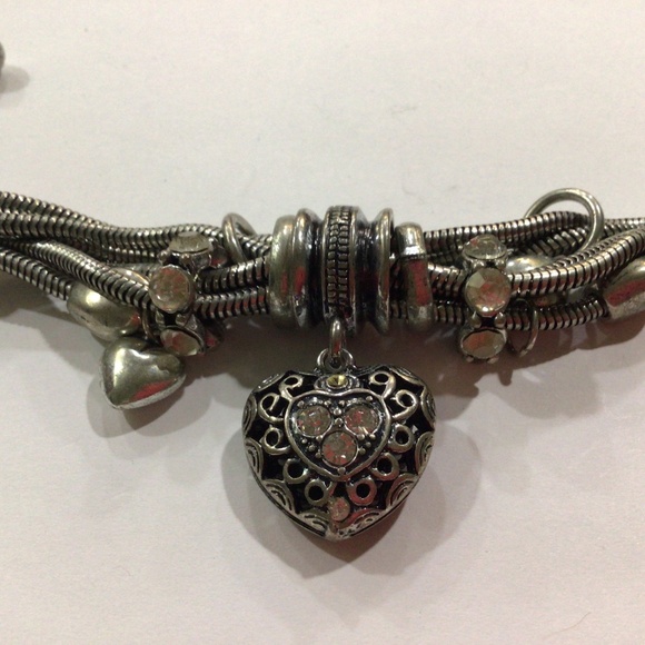 Silvertone bracelet. This bracelet has a lot going on. - Picture 2 of 4